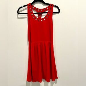 Red backless mini dress by Cotton Candy with metal grommet detail size S